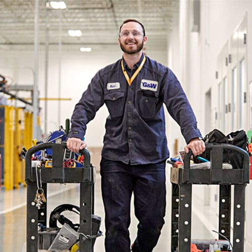 A man with two rolling carts.