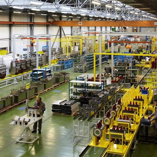 A large factory with yellow machines.